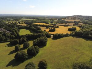 Aerial view to a meadow near Tonbrodge, Kent, UK